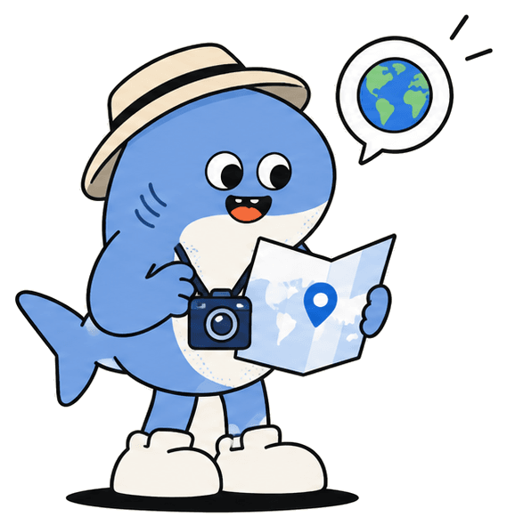 Shark mascot in a hat holding a map and a camera
