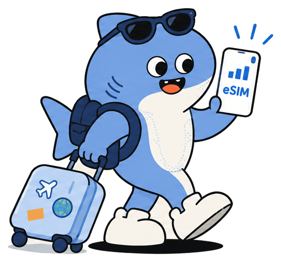 Shark mascot pulling a suitcase and holding a phone with an eSIM plan